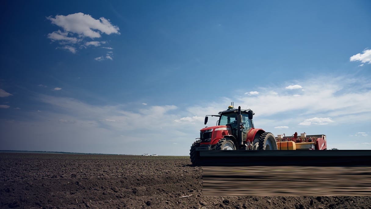CNH_Driving on the field. Agricultural machinery, tractor. Conception of harvest By mstandret_envato