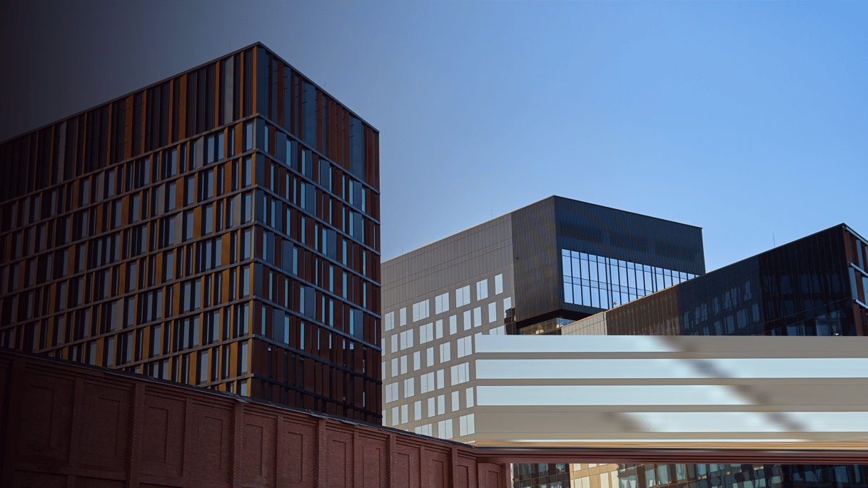Keypoint_Modern glass office buildings reflecting city skyline at sunset By Lazy_Bear_envato