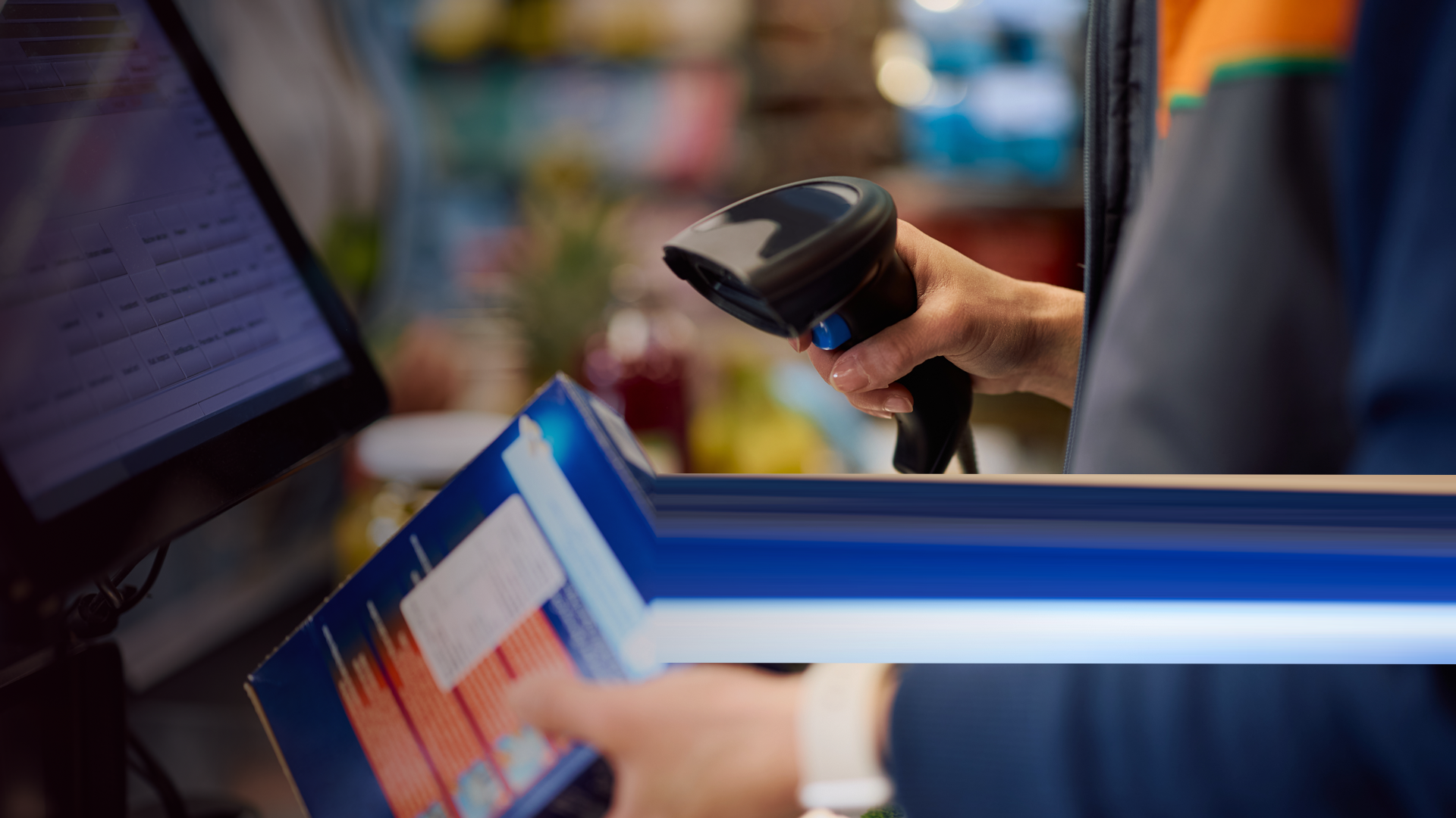 GS1_Close up of cashier scanning merchandise at the checkout. By drazenphoto_2_envato